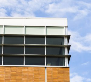 low angle building with windows brick wall